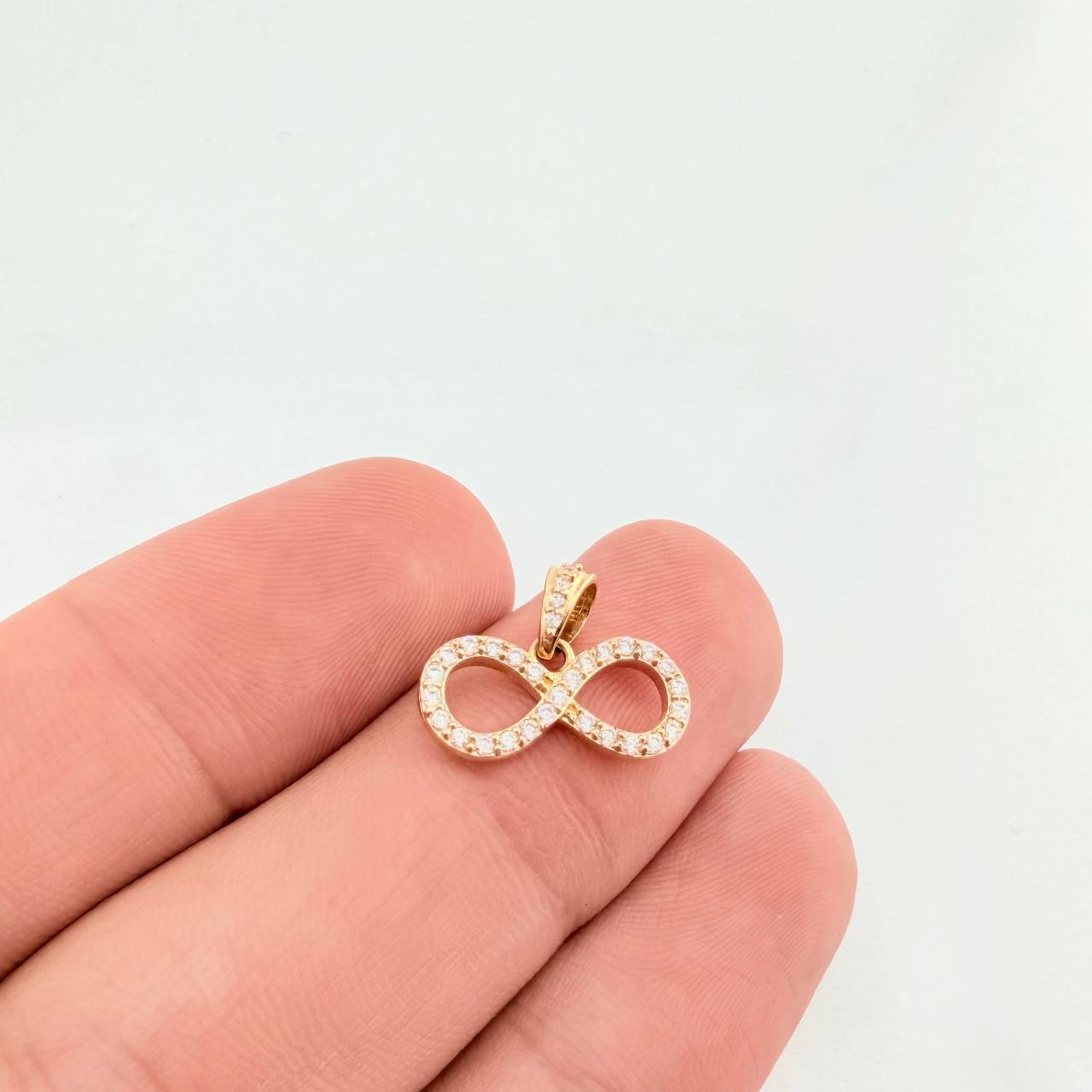 Dije Silueta Infinito Tupido 1.25gr / 3/4 in / Oro Amarillo 18K © Dije Silueta Infinito Tupido 1.25gr / 3/4 in / Oro Amarillo 18K ©