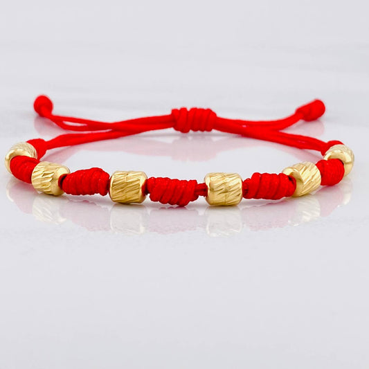 Red Woven Bracelet 7 Knots 6 Diamond Cut Cylinders Yellow Gold 18K