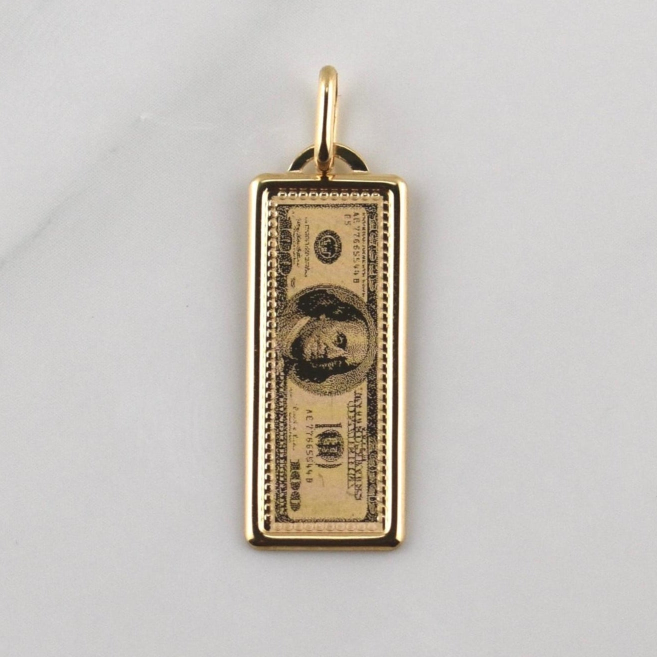 Dije 100 Dolares 1.1gr / 1 1/4 in / Oro Amarillo +4 18K Dije 100 Dolares 1.1gr / 1 1/4 in / Oro Amarillo +4 18K