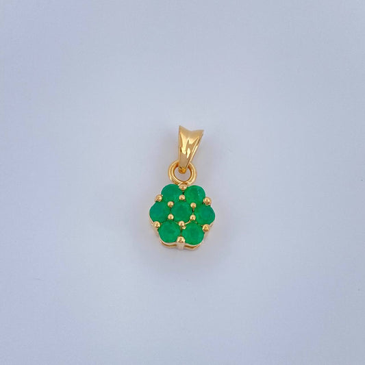 Dije Flor Esmeraldas 0.95gr / 1/2 in / Oro Amarillo 18K %