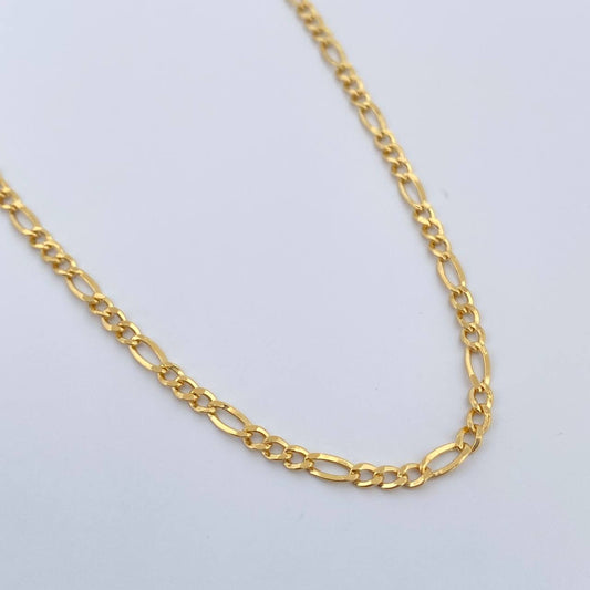 Cadena Figaro 3.15gr / 23 1/2 in / 2.1mm Oro Amarillo +1 18K %