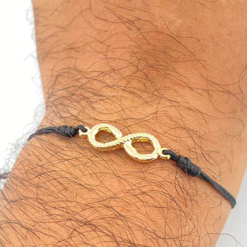 Pulsera Tejida Negra Infinito. 1.15gr / Oro 18K &