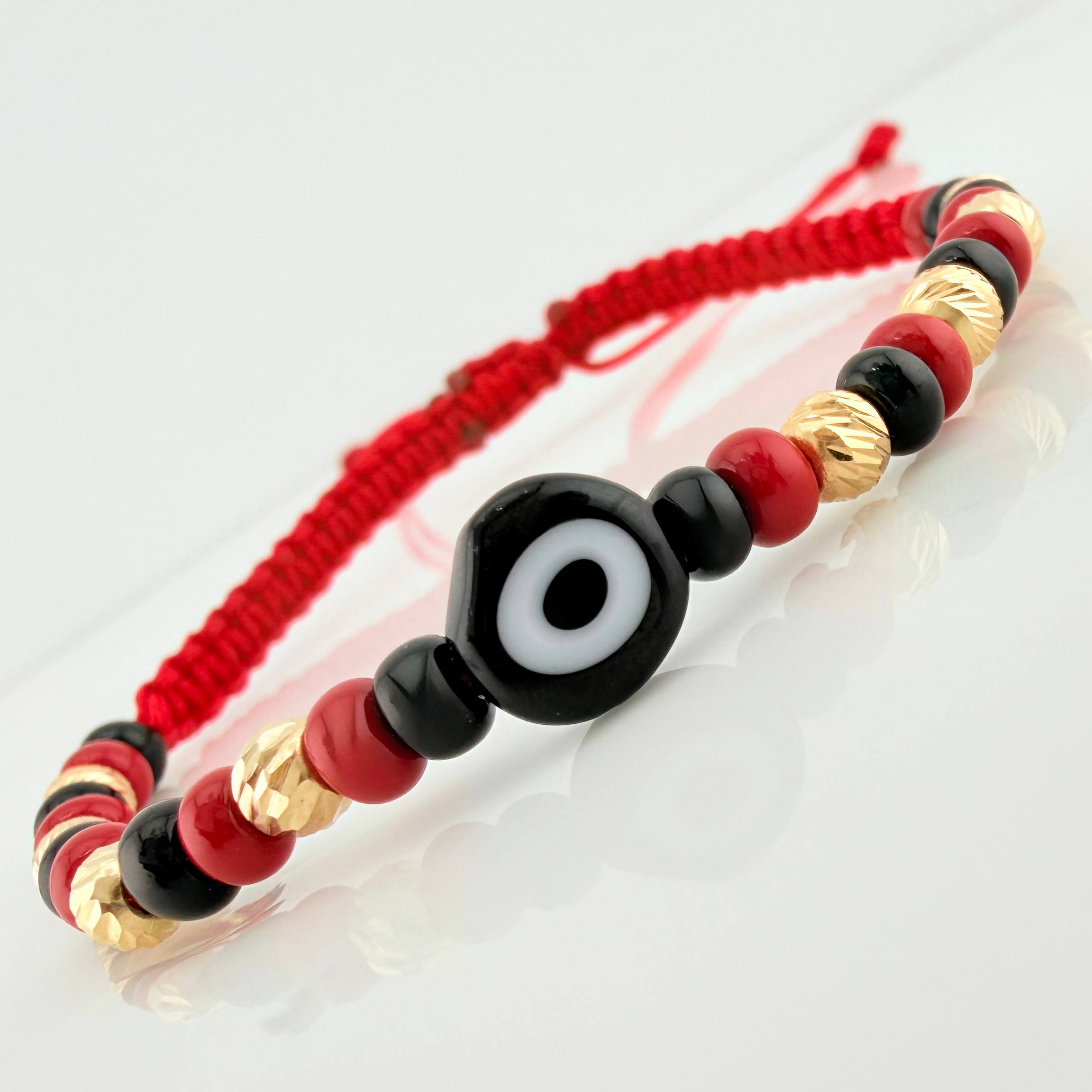 Red Woven Bracelet with Turkish Eye in 18K Yellow Gold