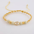 Pulsera Tejida Beige Herraje GC Bolas Lisas Oro Amarillo 18K