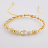 Pulsera Tejida Beige Herraje GC Bolas Lisas Oro Amarillo 18K