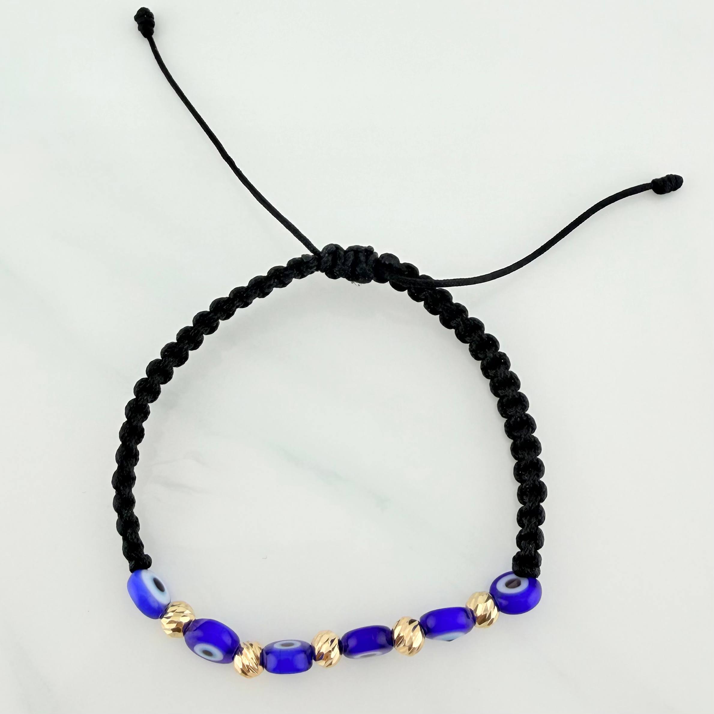 Black Woven Bracelet with Blue Evil Eye Charms in 18K Yellow Gold