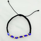 Black Woven Bracelet with Blue Evil Eye Charms in 18K Yellow Gold