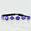 Black Woven Bracelet with Blue Evil Eye Charms in 18K Yellow Gold