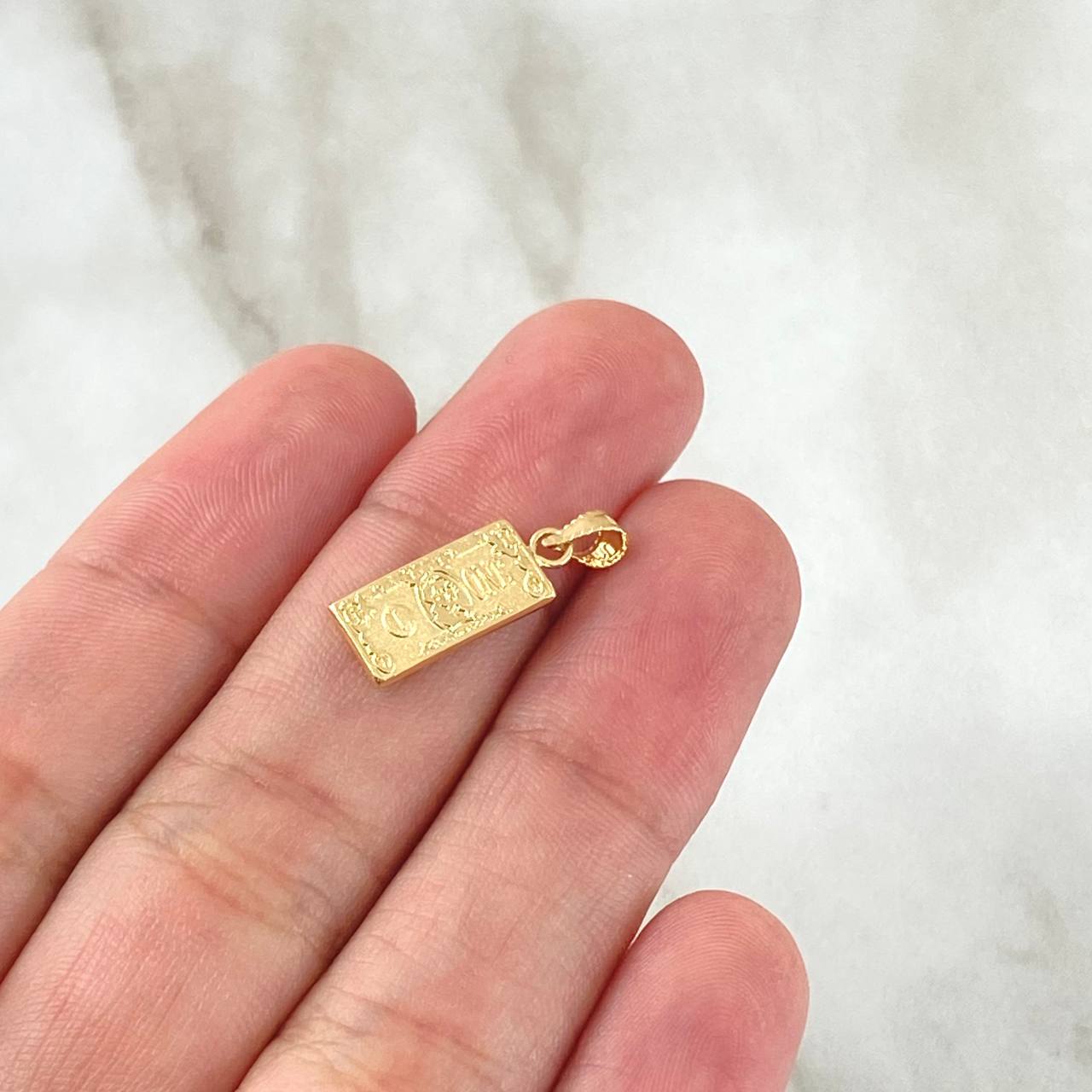Dije Dólar 0.6gr / 2cm / Oro Amarillo 18K ©