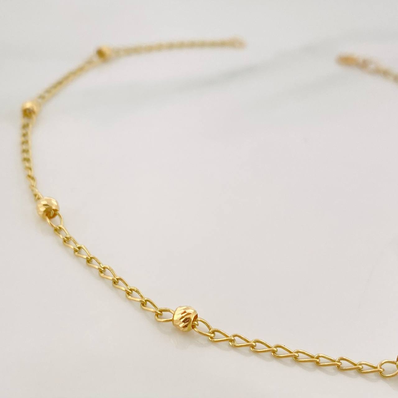 Tobillera Espiga Bolas 1.65 g / 9 3/4 in / 3 mm Oro Amarillo 18K