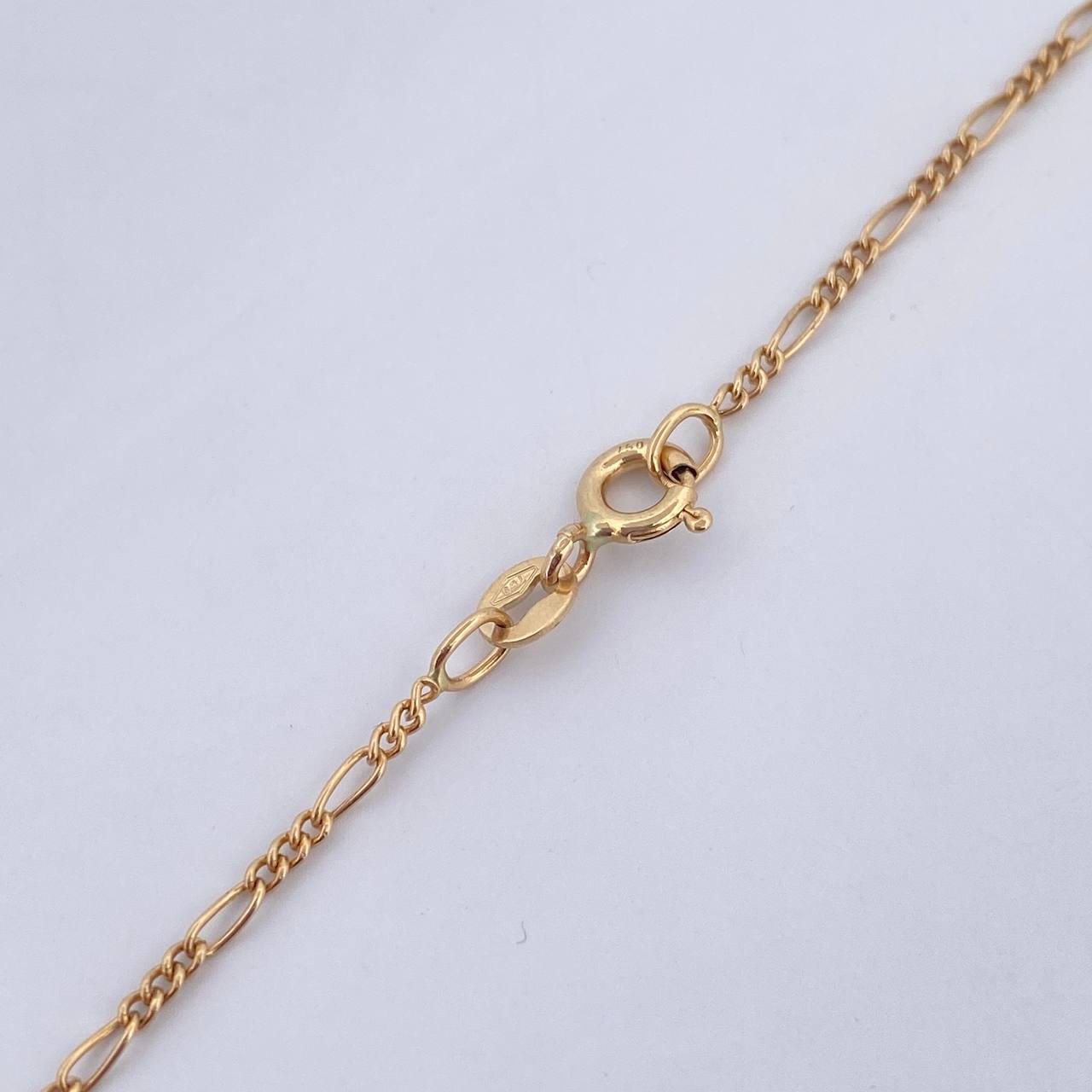 Cadena Figaro 1.45gr / 45.3cm / 1.2mm Oro Amarillo +1 18K $