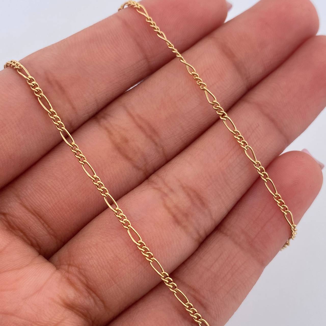 Cadena Figaro 1.45gr / 45.3cm / 1.2mm Oro Amarillo +1 18K $