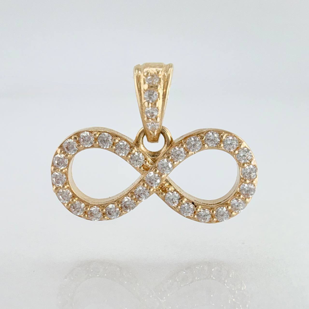 Dije Silueta Infinito Tupido 1.25gr / 3/4 in / Oro Amarillo 18K ©