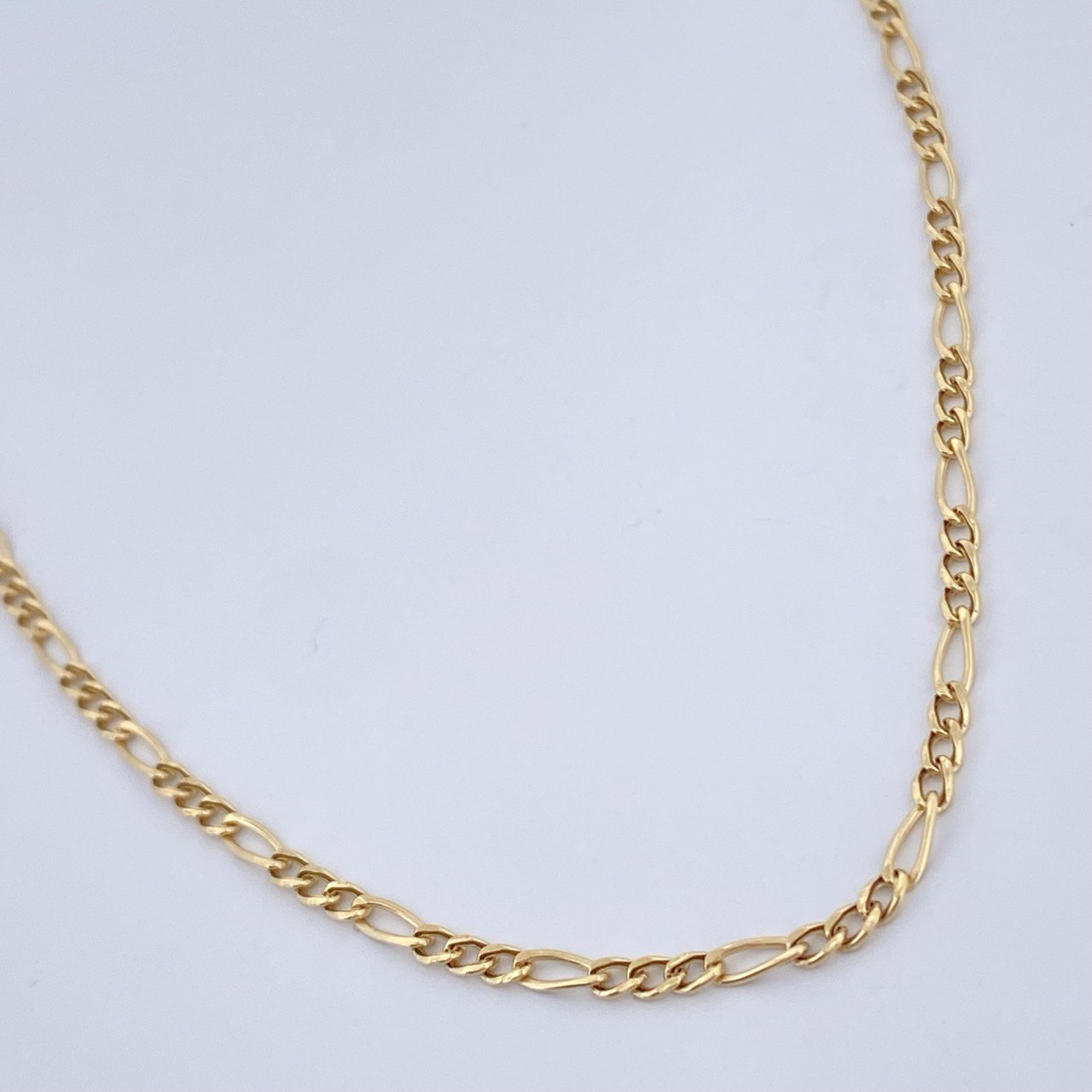Figaro Chain 1.4gr / 17.8in / 18K Gold +1 &