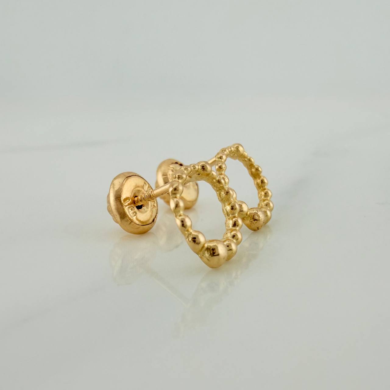 Topos Circulo Tupido 0.9gr / 7.5mm Oro Amarillo 18K %