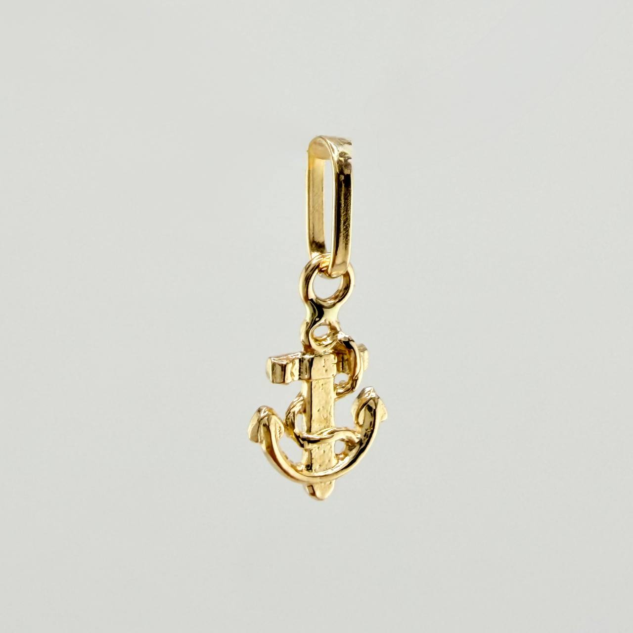 Dije Ancla 0.3gr / 1/2 in / Oro Amarillo 18K