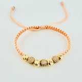 Woven Pink Bracelet with Diamond Cut Beads in 18K Yellow Gold