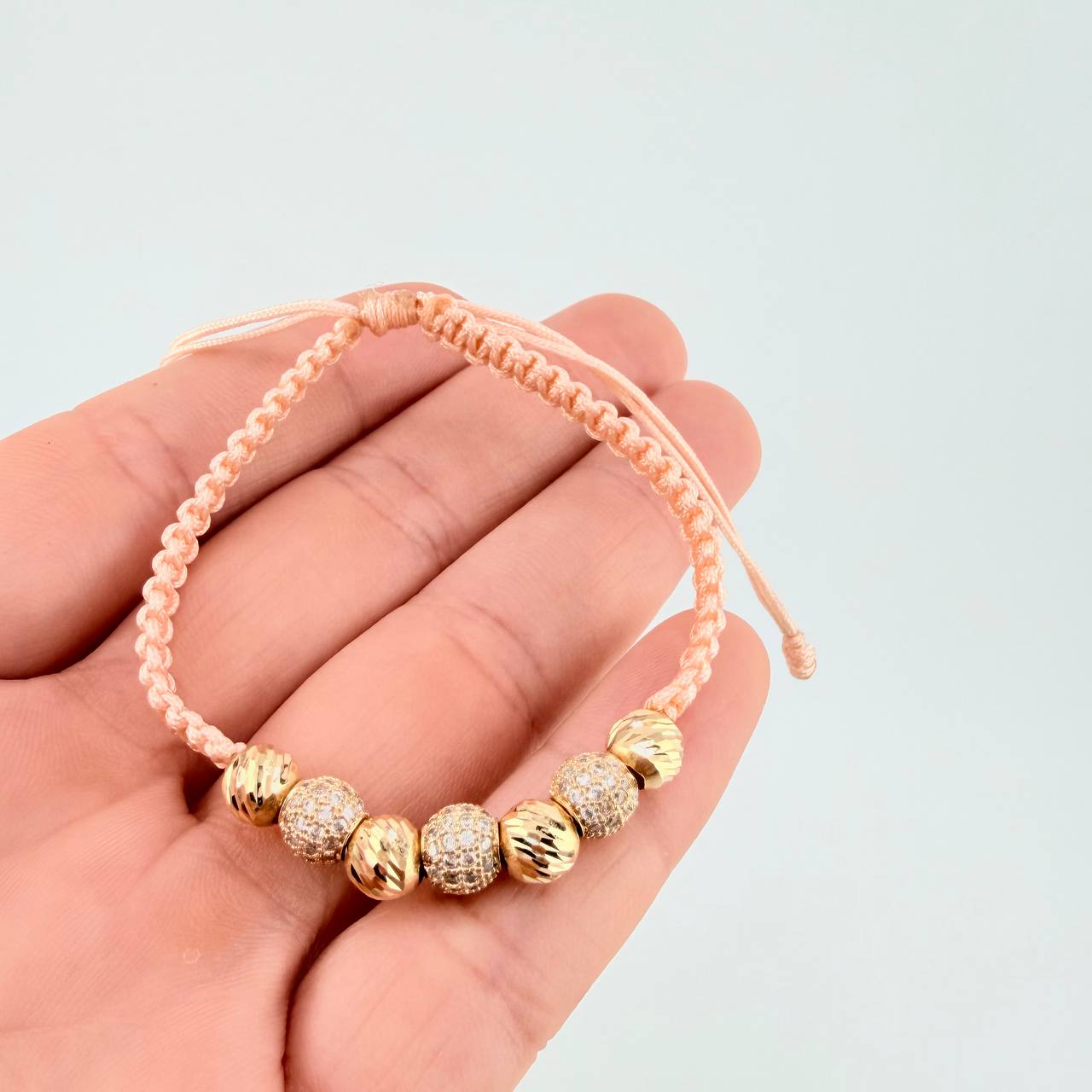 Woven Pink Bracelet with Diamond Cut Beads in 18K Yellow Gold