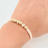Woven Pink Bracelet with Diamond Cut Beads in 18K Yellow Gold