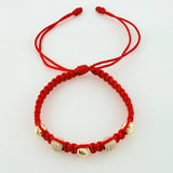 Red Woven Bracelet with Diamond Cut Beads in 18K Yellow Gold