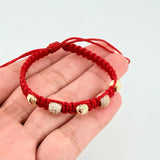 Red Woven Bracelet with Diamond Cut Beads in 18K Yellow Gold