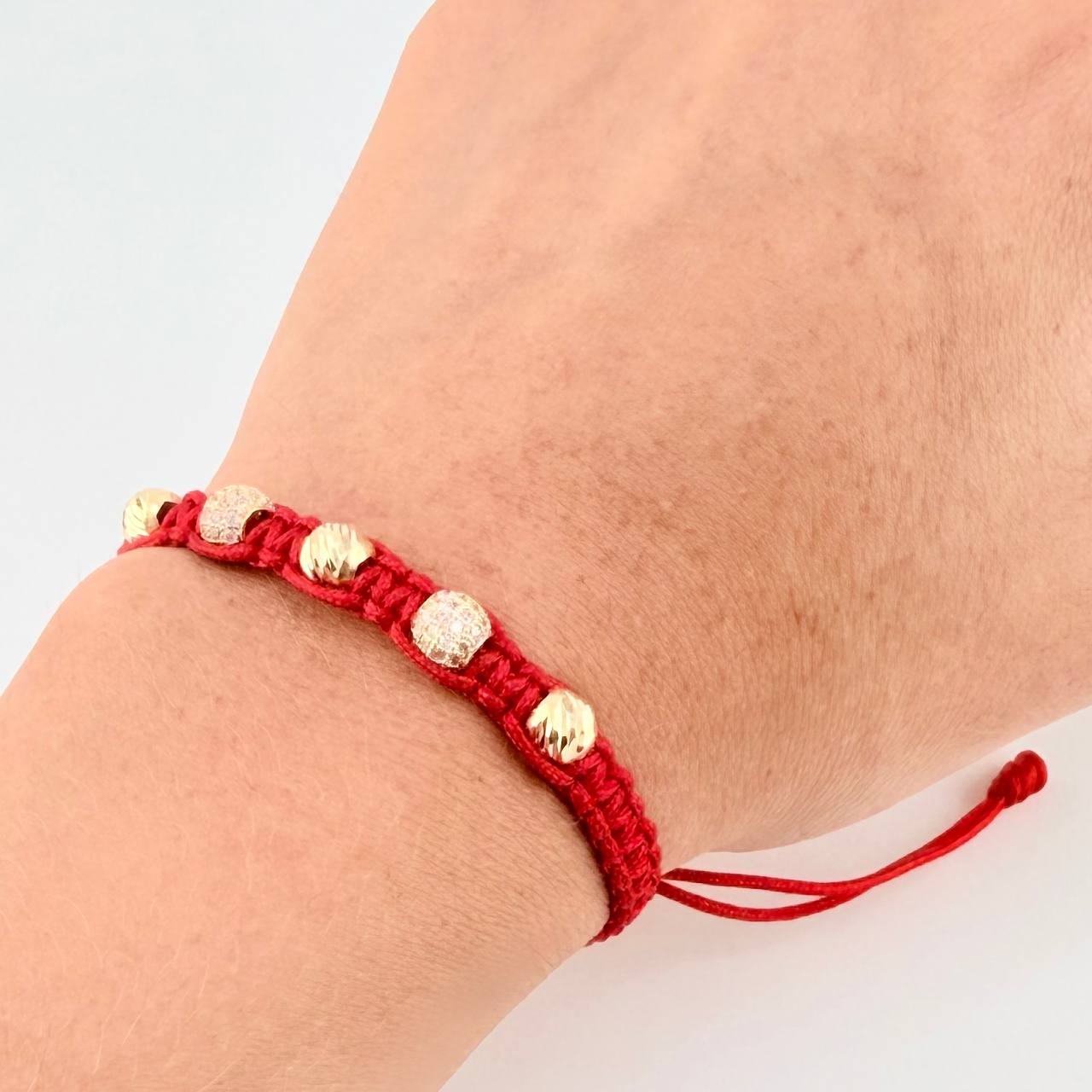 Red Woven Bracelet with Diamond Cut Beads in 18K Yellow Gold