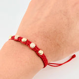 Red Woven Bracelet with Diamond Cut Beads in 18K Yellow Gold