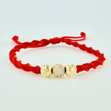 Red Woven Bracelet with Diamond Cut Beads in 18K Yellow Gold