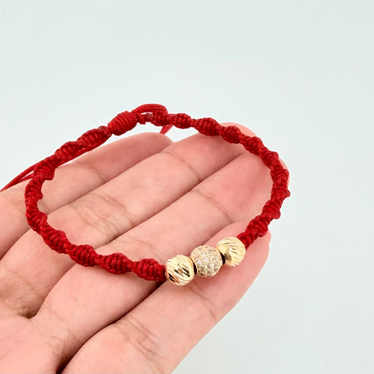 Red Woven Bracelet with Diamond Cut Beads in 18K Yellow Gold