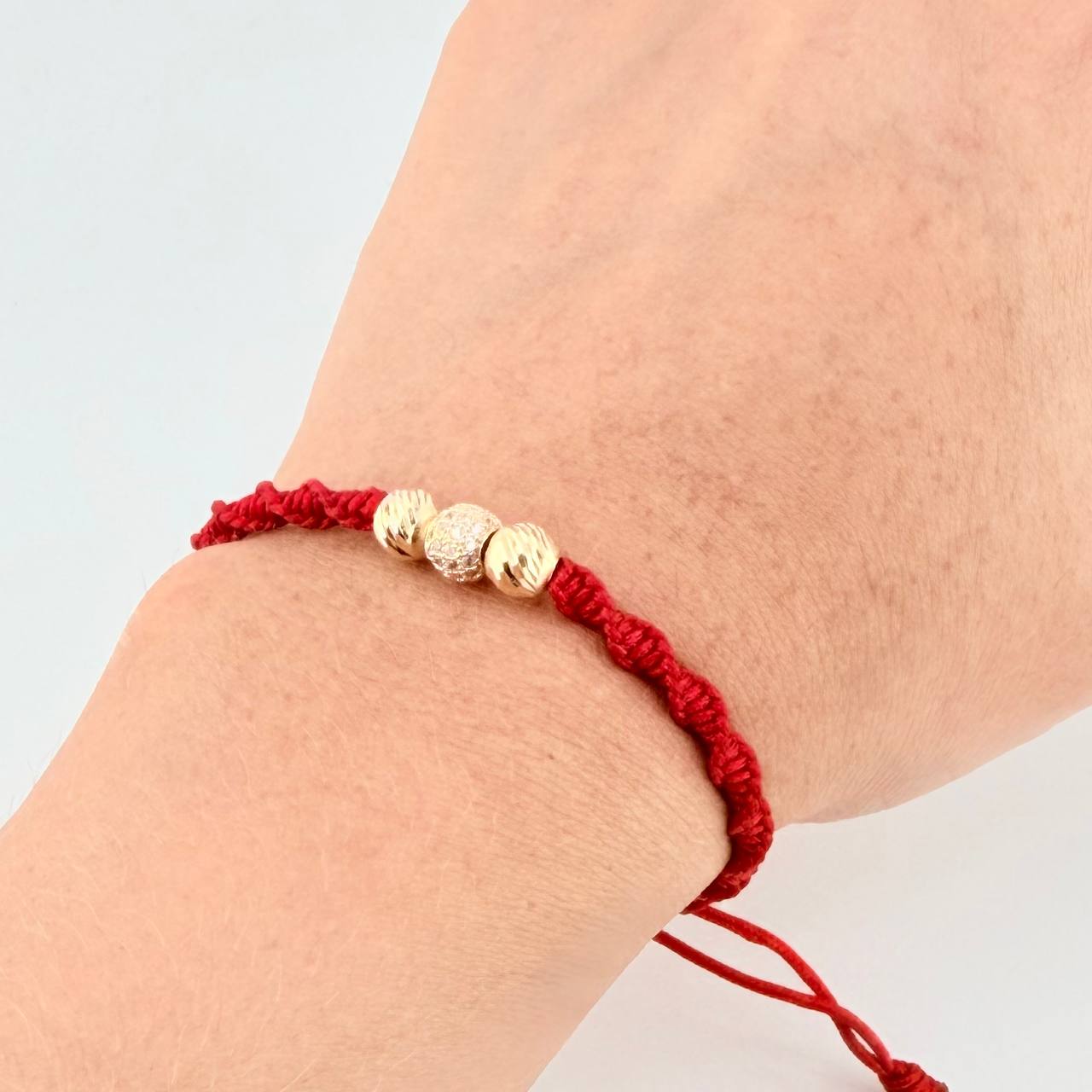 Red Woven Bracelet with Diamond Cut Beads in 18K Yellow Gold