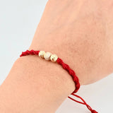 Red Woven Bracelet with Diamond Cut Beads in 18K Yellow Gold