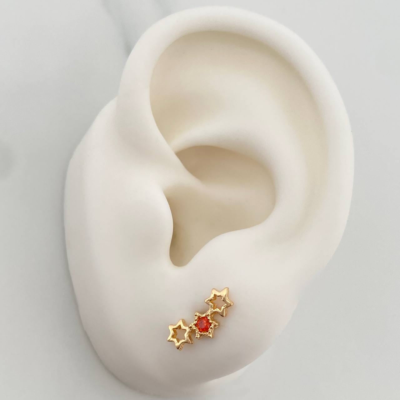 Topos Silueta Estrellas 1.05gr / 11.6mm Oro Amarillo 18K %