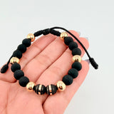 Pulsera Negra Neoros 2und Bolas 6und 1.85gr / 8mm Oro Amarillo 18K ©