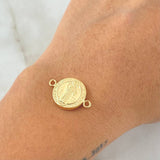 Herraje San Benito 1.1gr / 2.1cm / Troquelado Oro Amarillo 18K