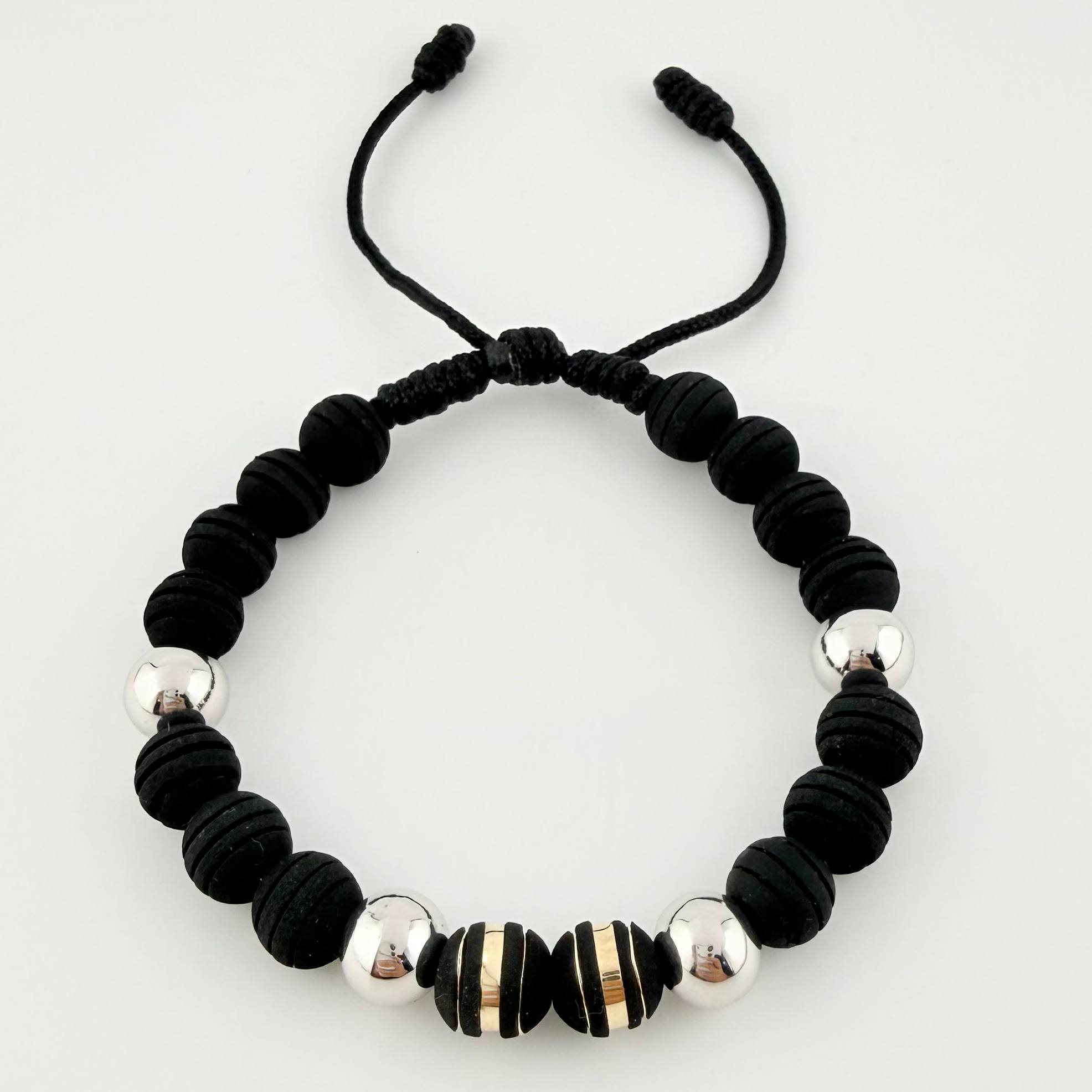 Pulsera Negra Neoros 2und Bolas 4und / 8mm Dos Oros Amarillo Blanco 18K *