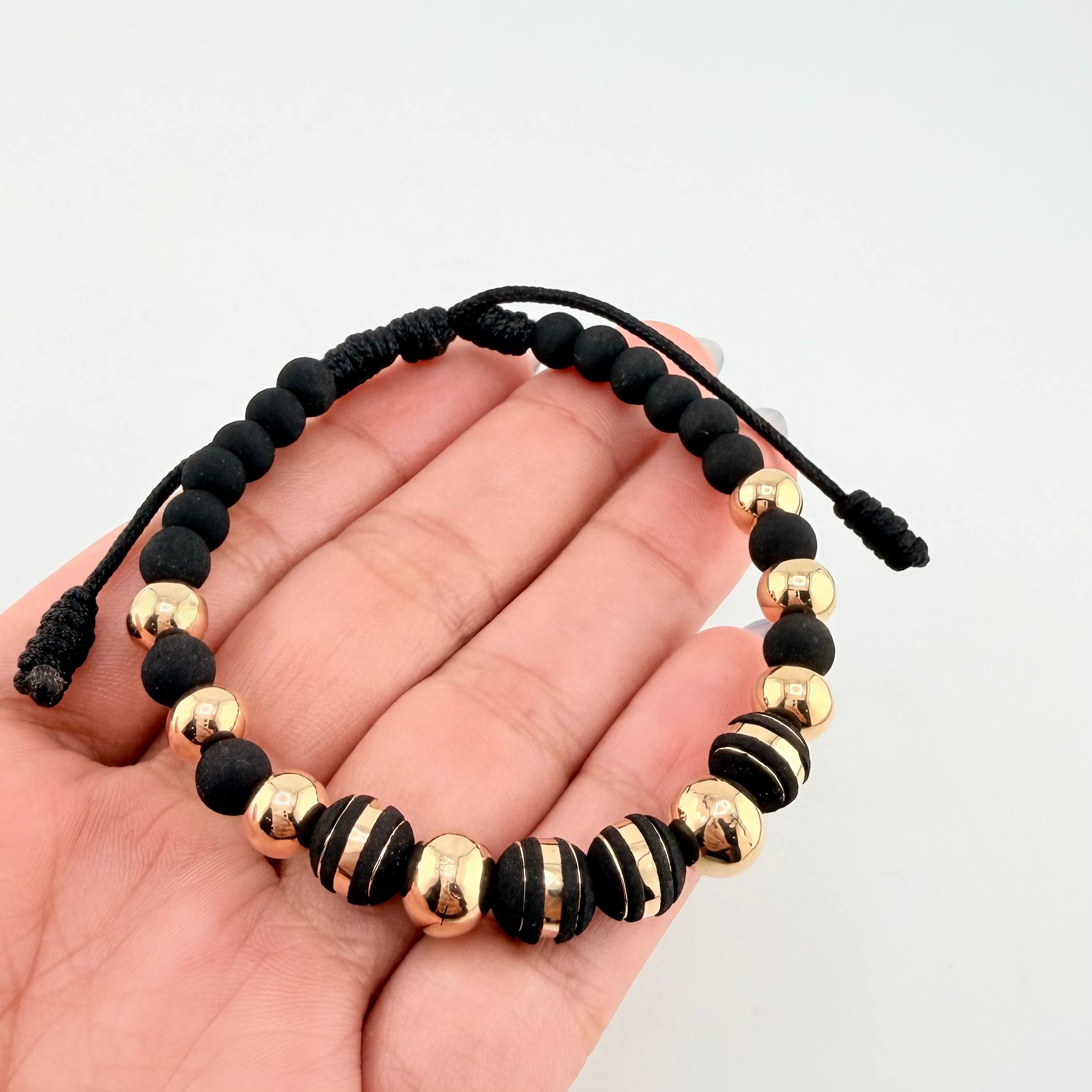 Pulsera Negra Neoros 4und Bolas 8und / 7mm-8mm Oro Amarillo 18K *
