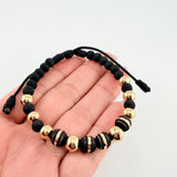 Pulsera Negra Neoros 4und Bolas 8und / 7mm-8mm Oro Amarillo 18K *