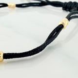 Pulsera Tejida Negra Tennis Oro Amarillo 18K