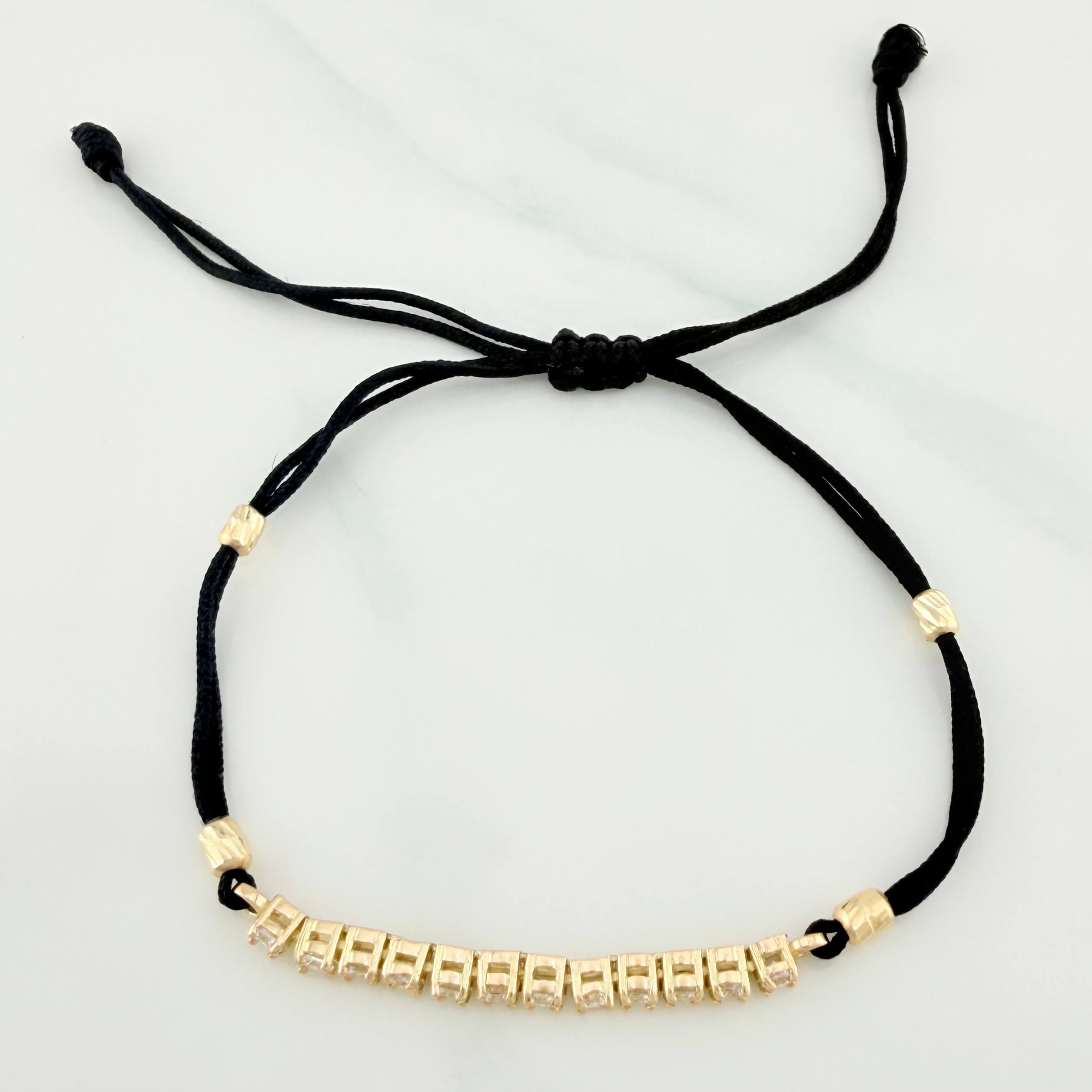 Pulsera Tejida Negra Retazo Tennis Oro Amarillo 18K