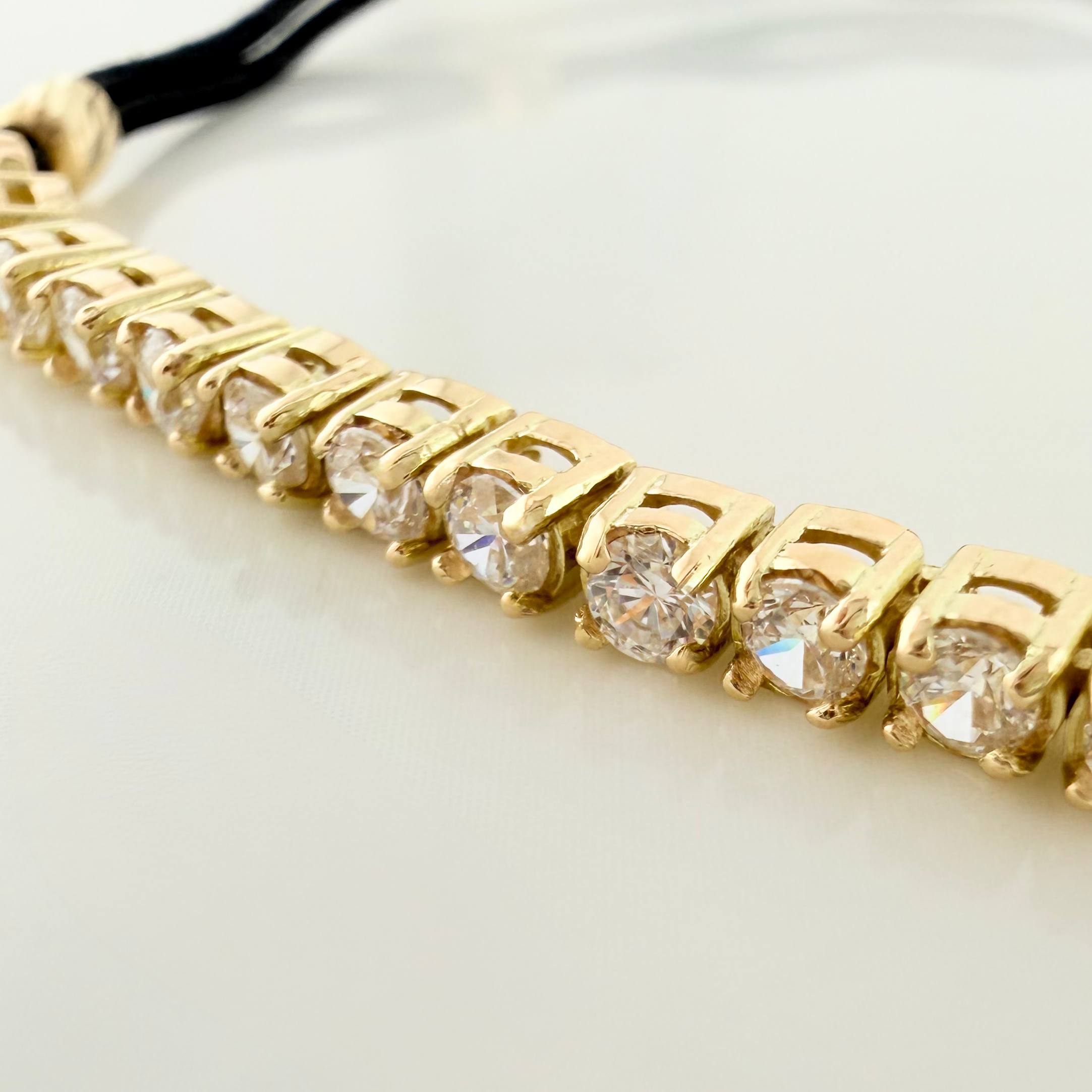 Pulsera Tejida Negra Retazo Tennis Oro Amarillo 18K