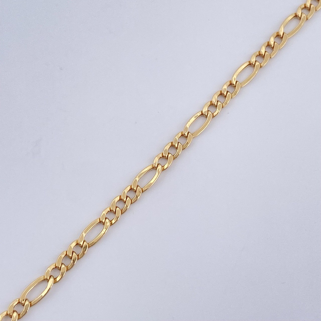 Figaro Bracelet 1gr / 7.8in / 18K Gold +1 &