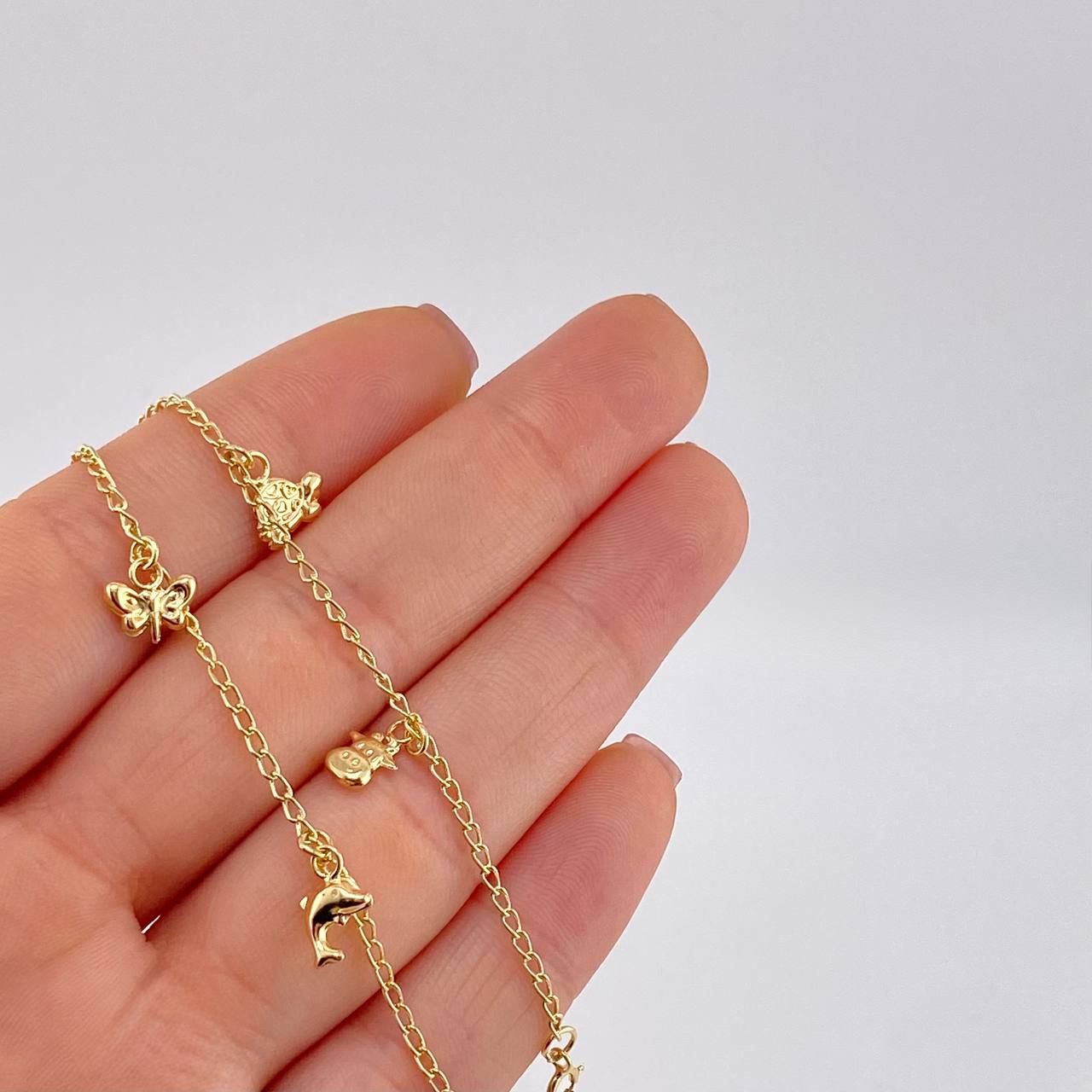 Pulso Espiga Dijes Animales 2.6 g / 7 1/2 in / 1.6 mm Oro Amarillo 18K