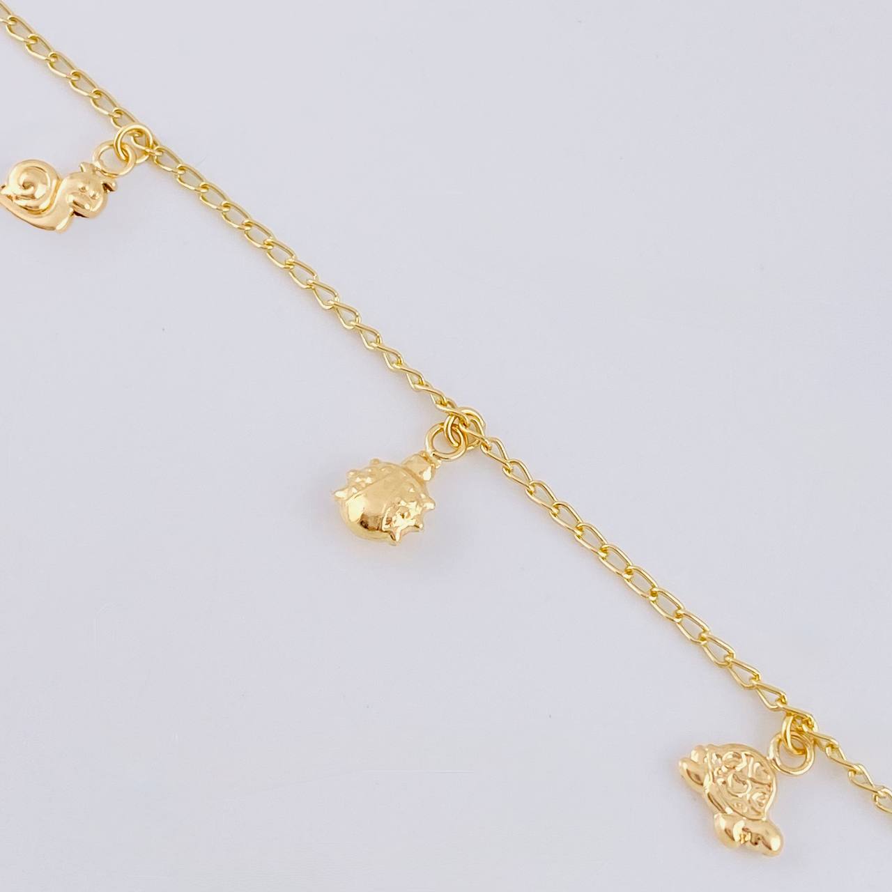 Pulso Espiga Dijes Animales 2.7 g / 7 1/2 in / 1.6 mm Oro Amarillo 18K