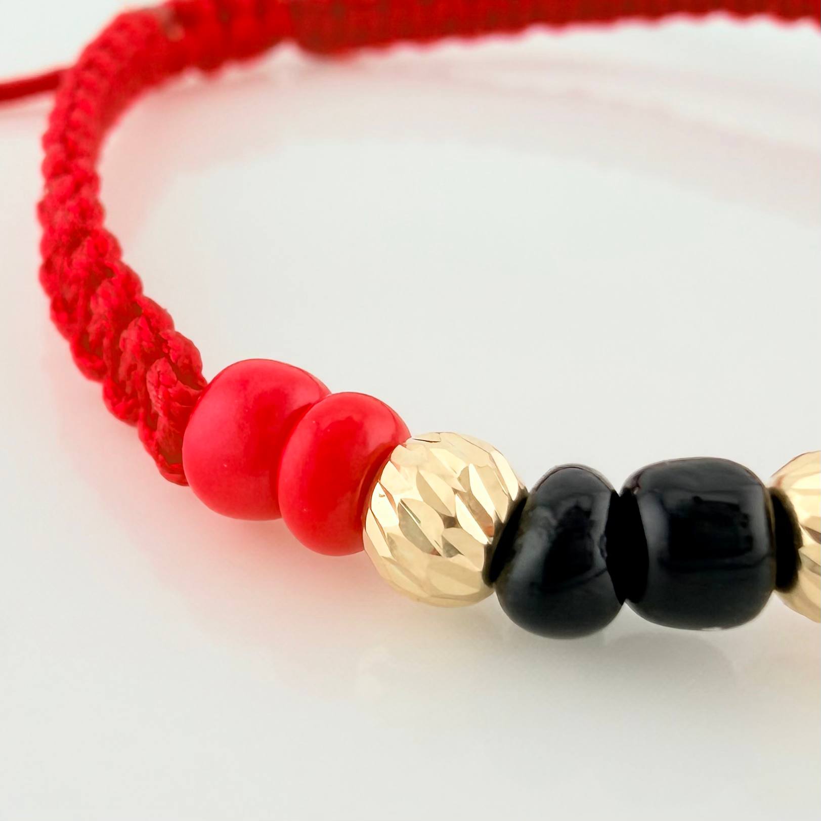 Red Woven Bracelet with Yellow Gold Beads 18K