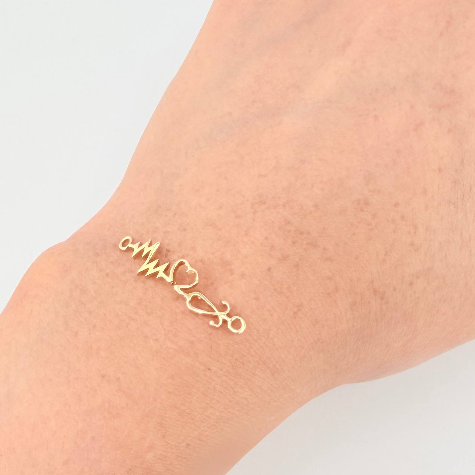 Herraje Corazon Electrocardiograma 0.8gr / 1 1/4 in / Oro Amarillo 18K