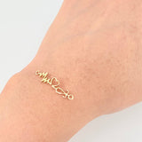 Herraje Corazon Electrocardiograma 0.8gr / 1 1/4 in / Oro Amarillo 18K