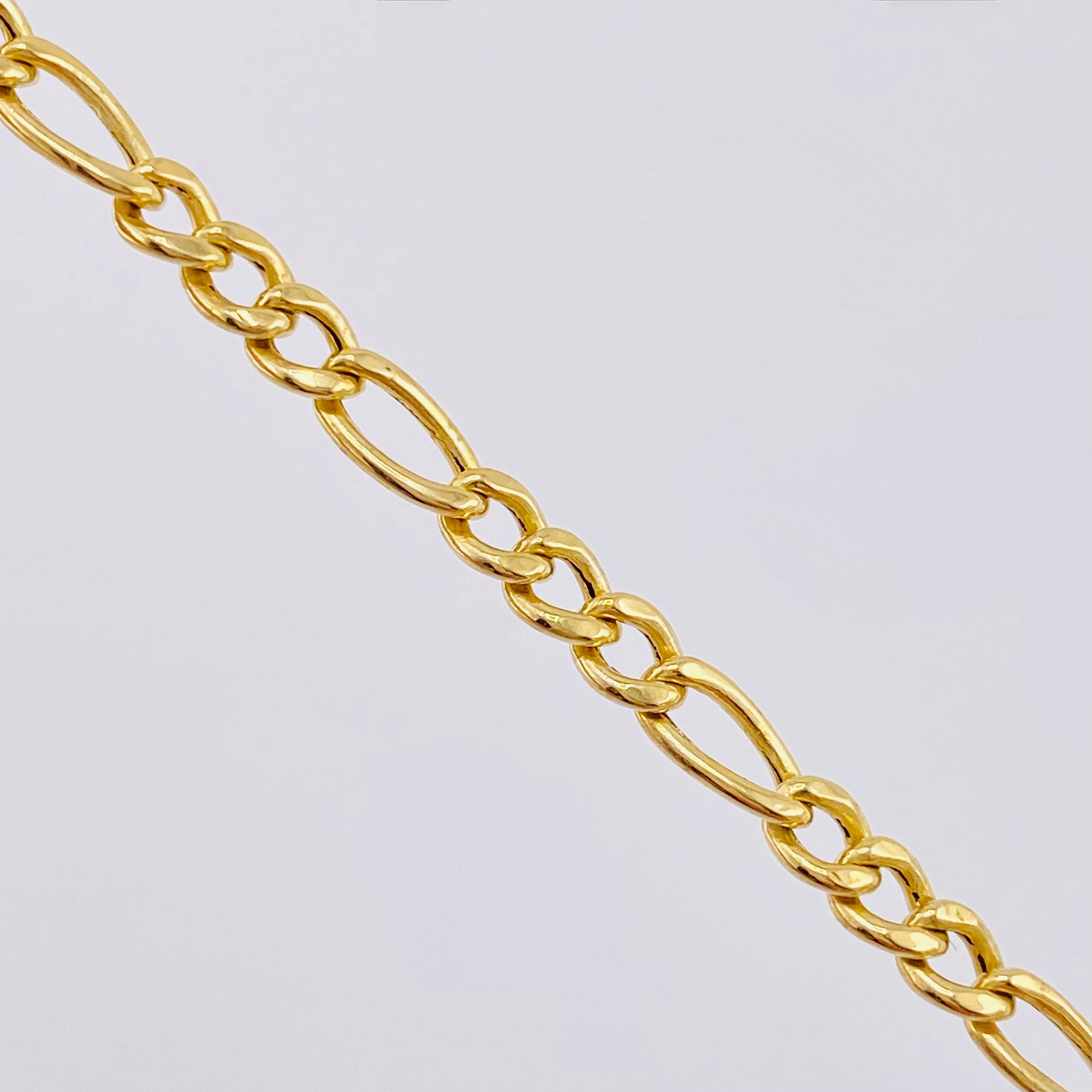 Cadena Figaro 9.35gr / 25 in / 3.7mm Oro Amarillo +1 18K ©