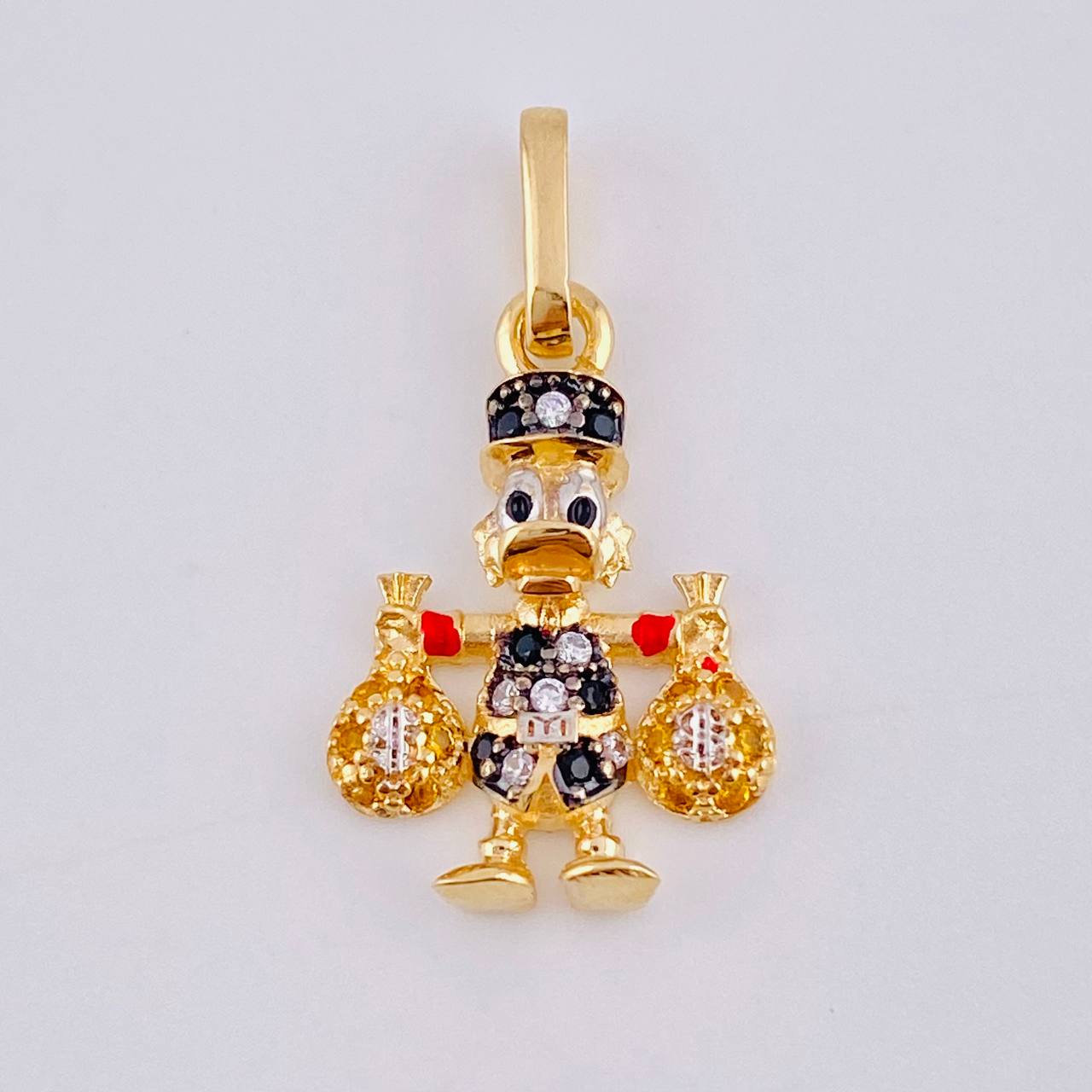 Dije Pato Bolsa Dinero 1.5gr / 1 in / Oro Amarillo 18K ©