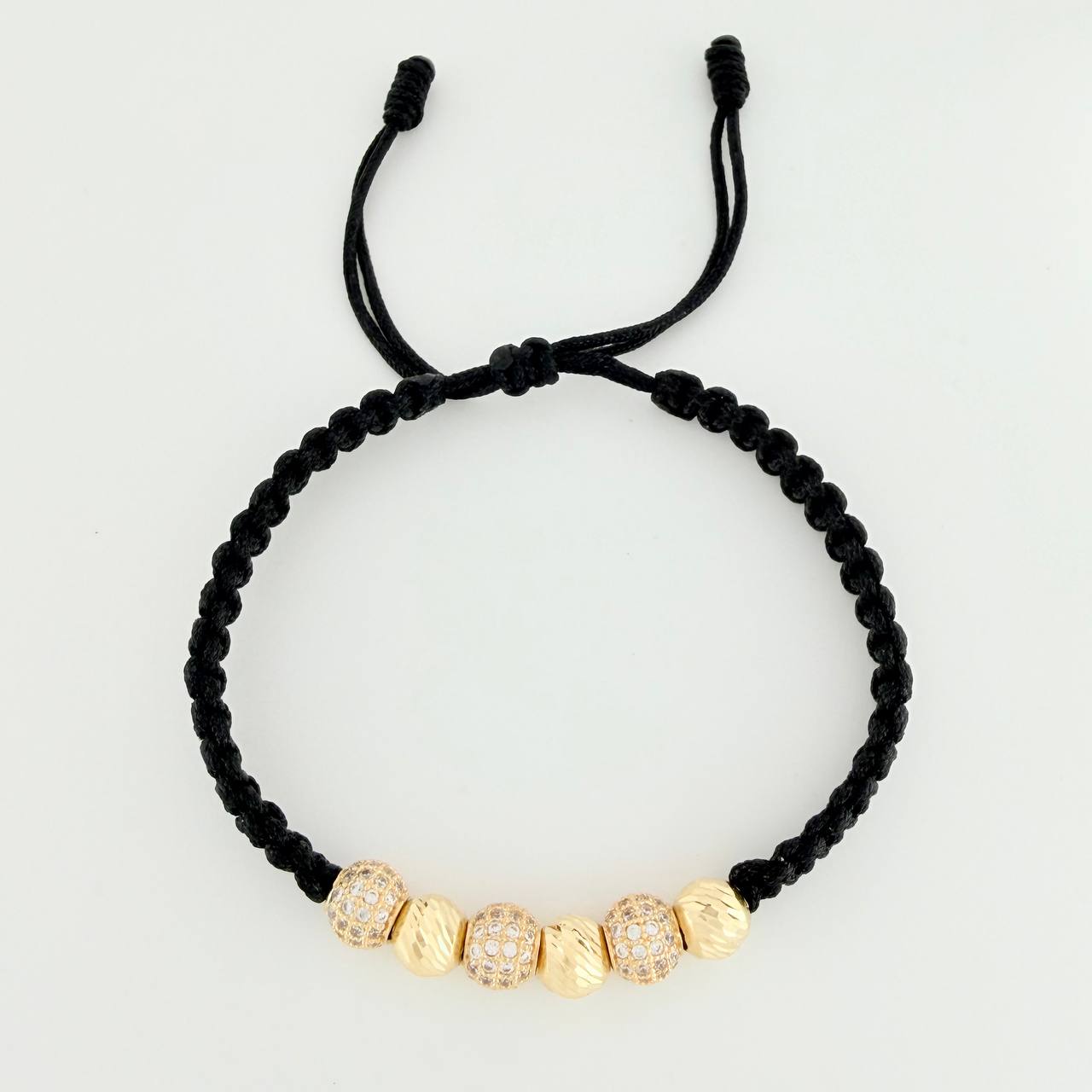 Pulsera Tejida Negra Bolas de Fuego Bolas Diamantadas Oro Amarillo 18K