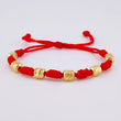 Pulsera Tejida Roja Siete Nudos Cilindros Diamantados Oro Amarillo 18K